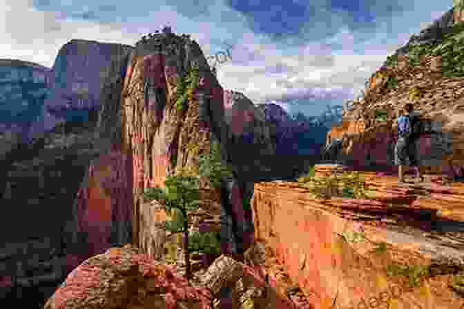 A Hiker Stands Atop Angels Landing, A Towering Rock Formation In Zion National Park. This Could Indeed Be The Path Less Traveled Complete With Over 100 Pictures Of Cusco Machu Picchu And More