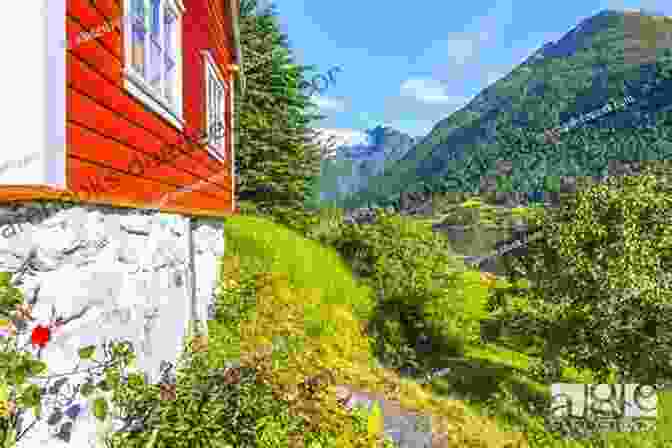 Colorful Wooden Houses In Balestrand With Mountains In The Background On The Edge Of The Fjord