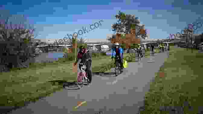 Cyclists Riding Along The Anacostia Riverwalk Trail With The Frederick Douglass National Historic Site In The Background Best Easy Bike Rides Washington DC (Best Bike Rides Series)