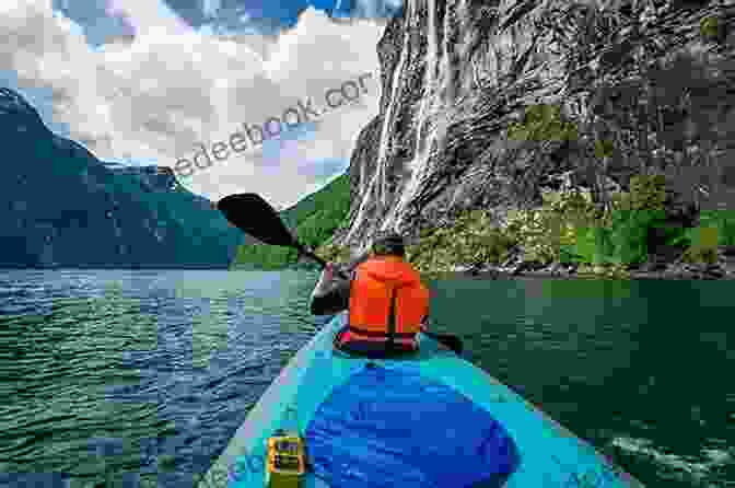 Kayaking In The Sognefjord With Mountains In The Background On The Edge Of The Fjord