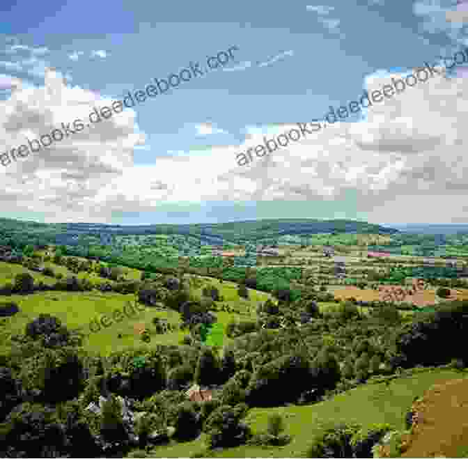 Panoramic View Of Gloucestershire Countryside, Featuring Rolling Hills, Lush Greenery, And Historic Buildings Gloucestershire: A County Guide (Barnaby S Relocation Guides 2)